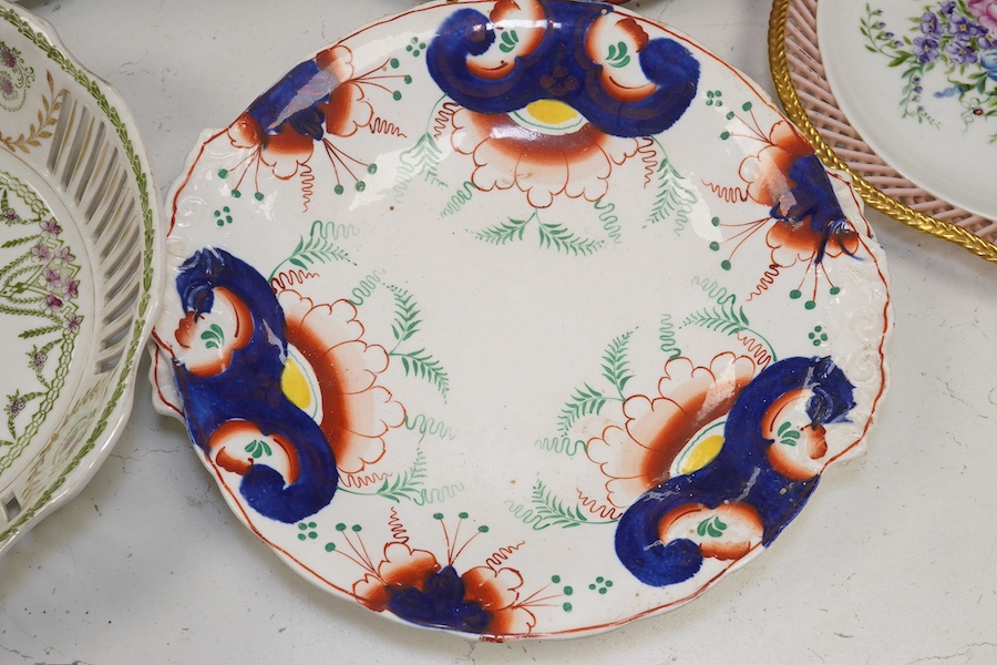 Ten French Luneville floral plates, a hand painted basket edged plate and various part dinner service plates, 24cm in diameter. Condition - mostly fair to good